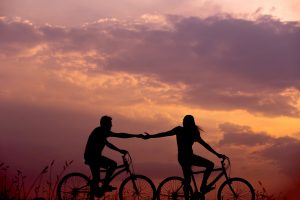 couples riding bikes