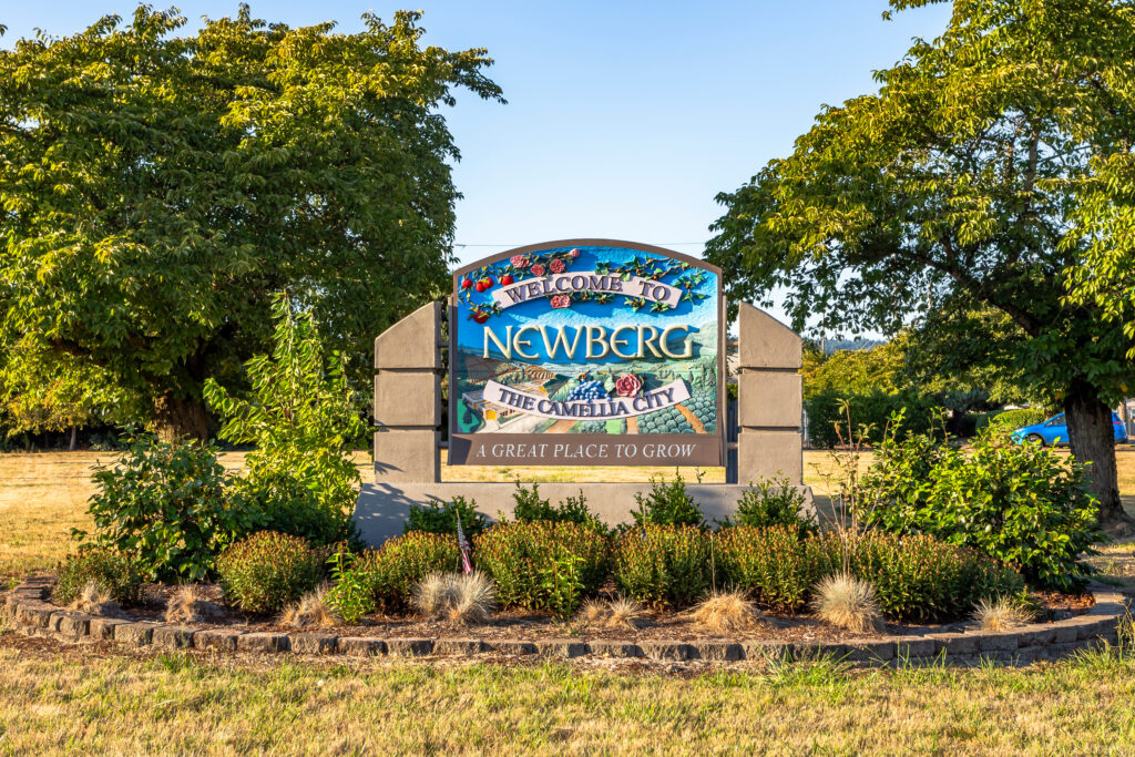 Image of the "Welcome to Newberg" road sign at the entrance to the city in Newberg, Oregon. Core Values Counseling offers virtual therapy in Newberg, Oregon and throughout Oregon.