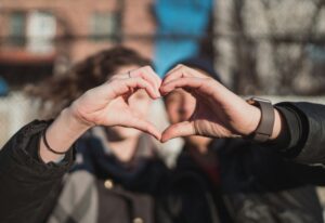 two people combine hands to form a heart shape. Photo is for a blog post by Sabrina Walters of Core Values Counseling about Valentine's Day.