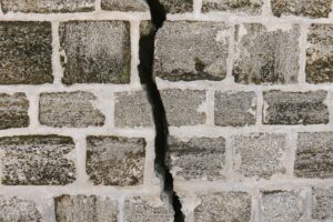 Image of a crack in a brick wall. For a blog article by Sabrina Walters of Core Values Counseling regarding Affair Recovery.